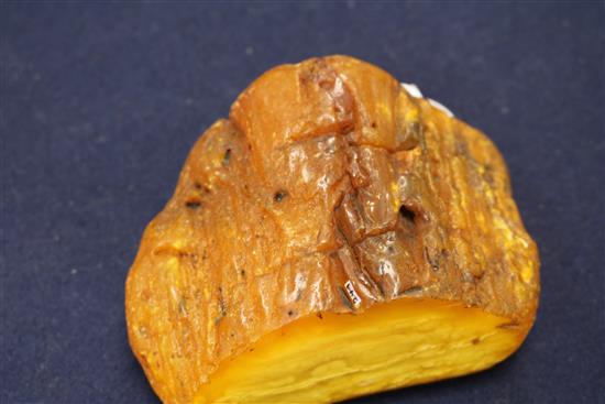 A piece of raw amber carved with the crest of the Polish City of Gdansk with the date 997-1997.